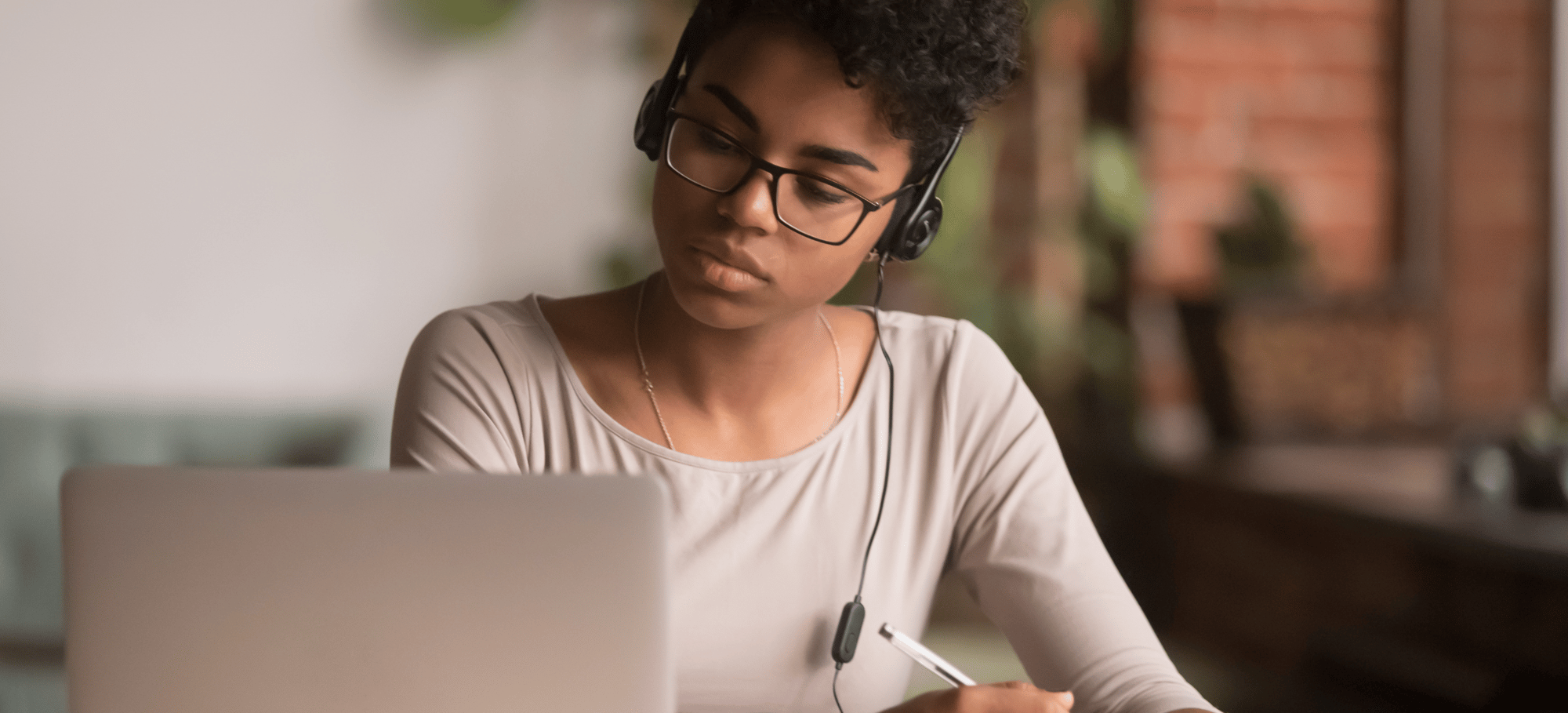 Photograph of a museum professional attending an online training course. Photograph of a museum professional attending an online training course.